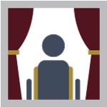 Person sitting in a wheelchair in a window